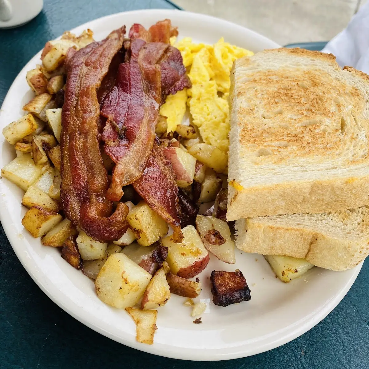 Two Eggs with Four Strips of Bacon