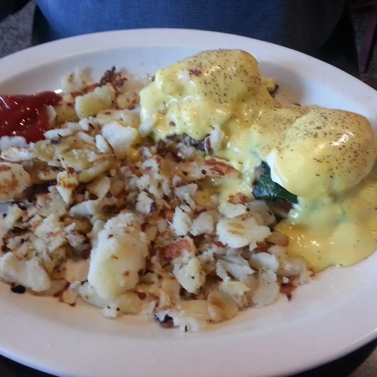 Mama Maria's Eggs Benedict with Spinach Mushrooms Ham Served with Home Fries Hash Browns or Grits