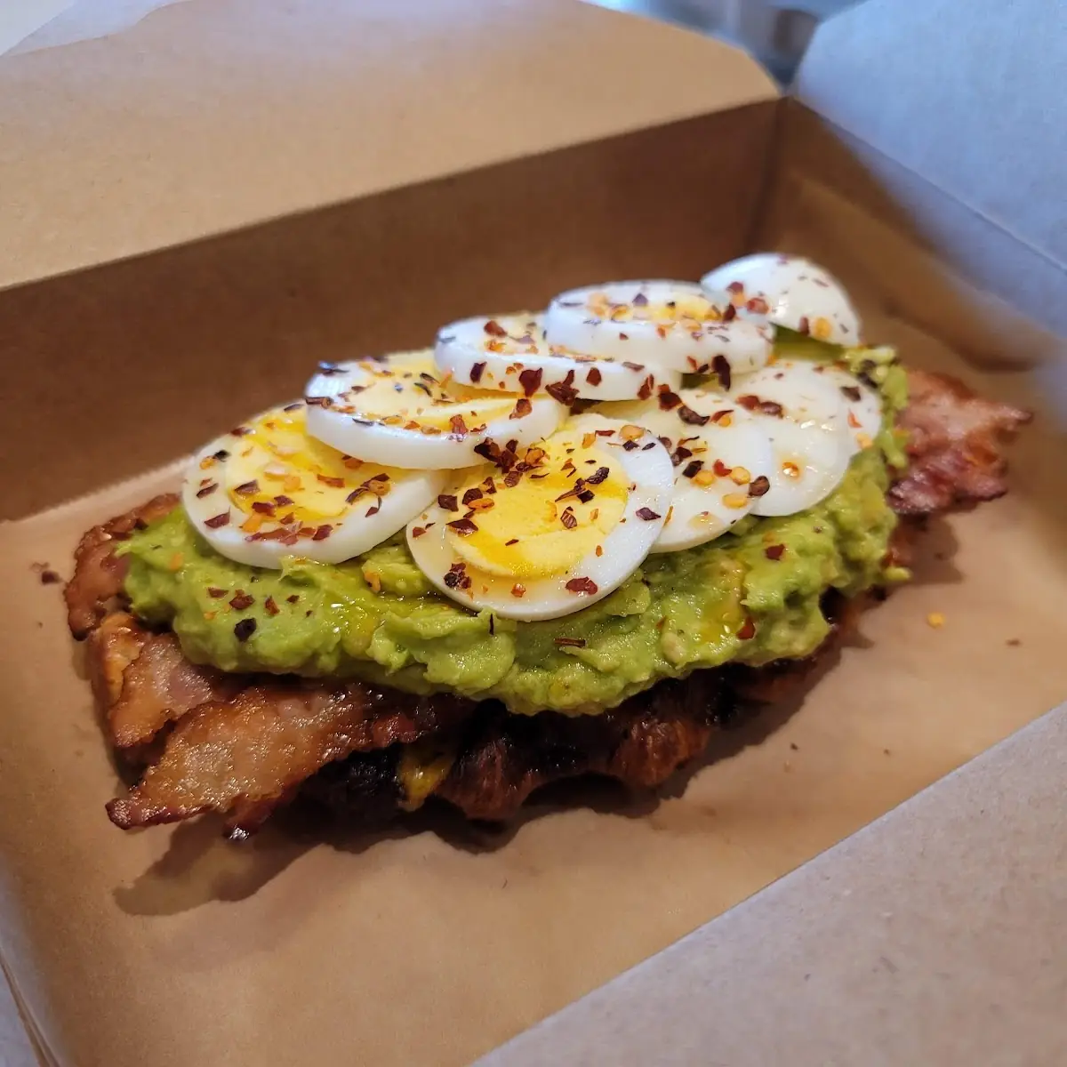 Avocado Toast with Bacon Hard Boiled Egg on a Croffle