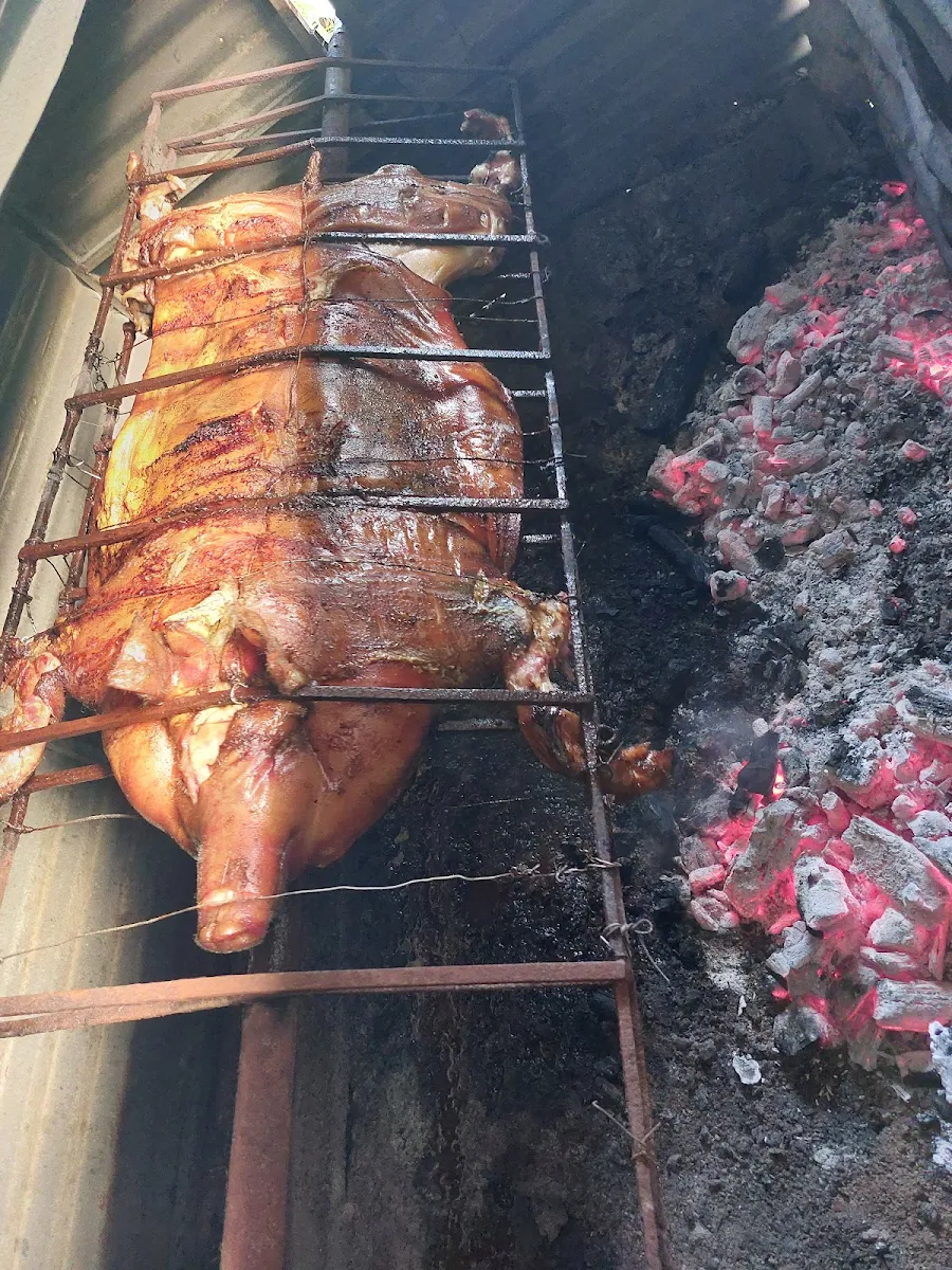 Lechon Asado Al Carbón