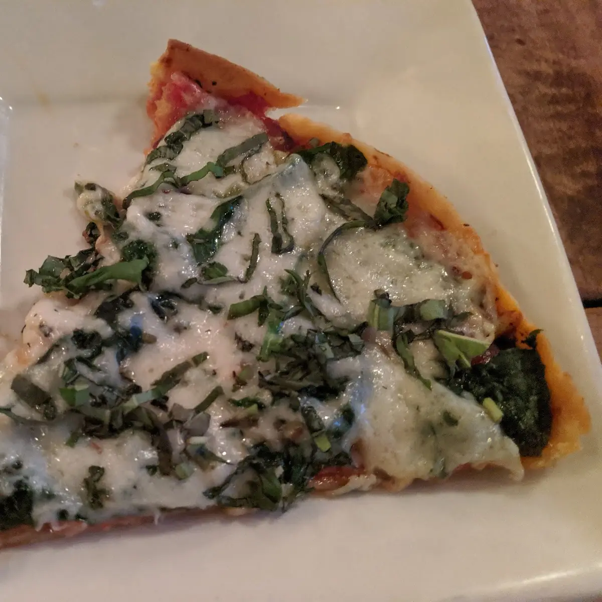 Thin Crust Pizza with Green Peppers Basil and Spinach