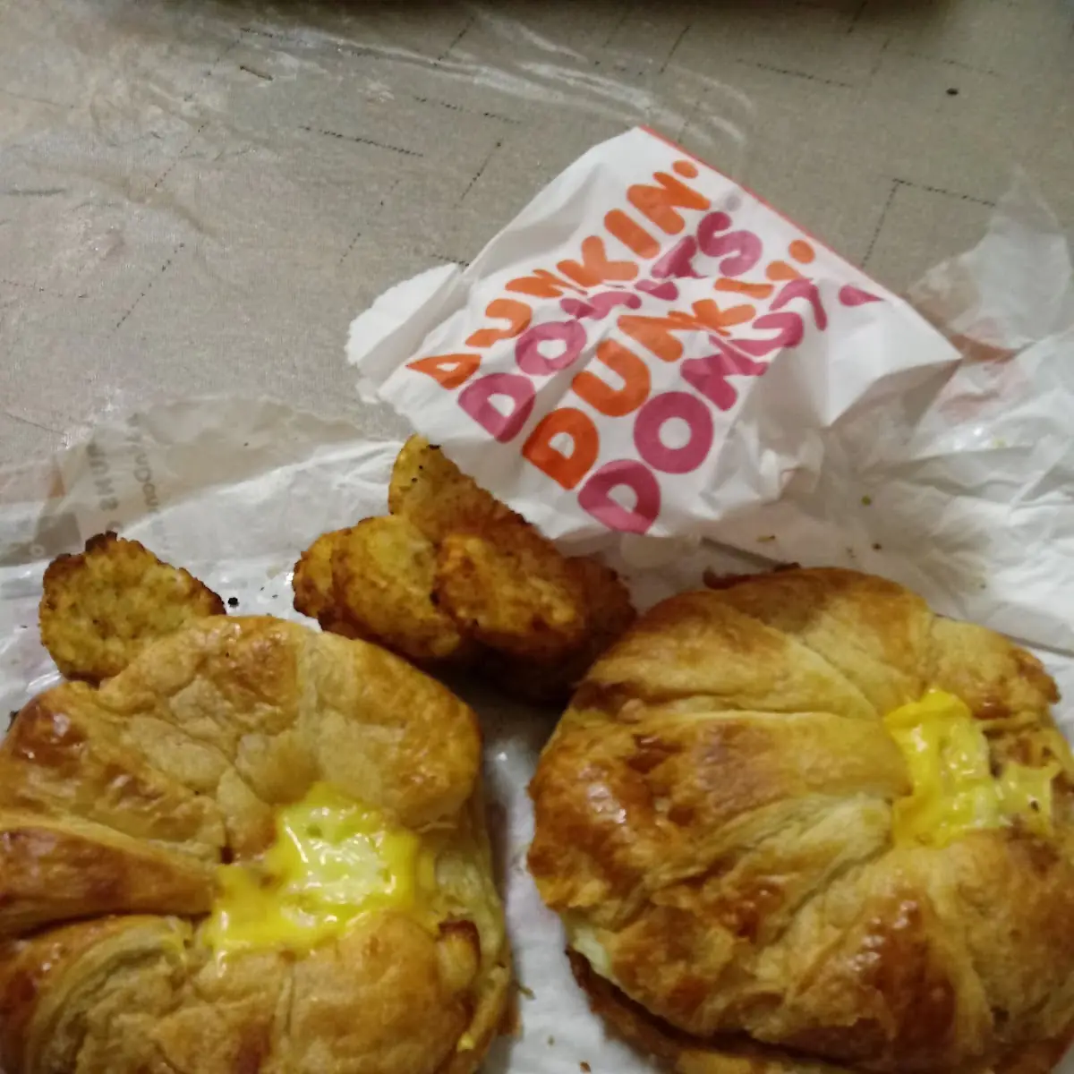 Bacon Egg and Cheese Croissant with Hash Browns