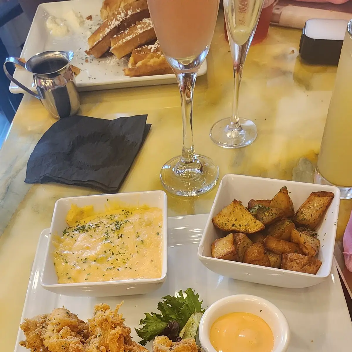 Lobster Bites Cheese Grits and Potatoes