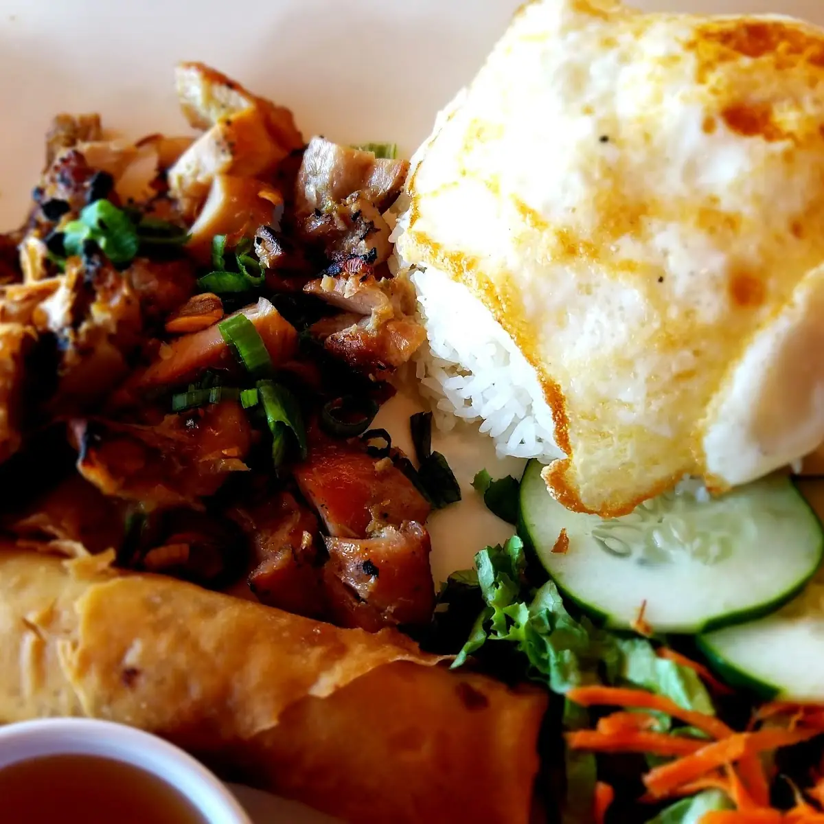 Saigon Style Rice Plate with BBQ Pork Crispy Imperial Roll and Fried Egg
