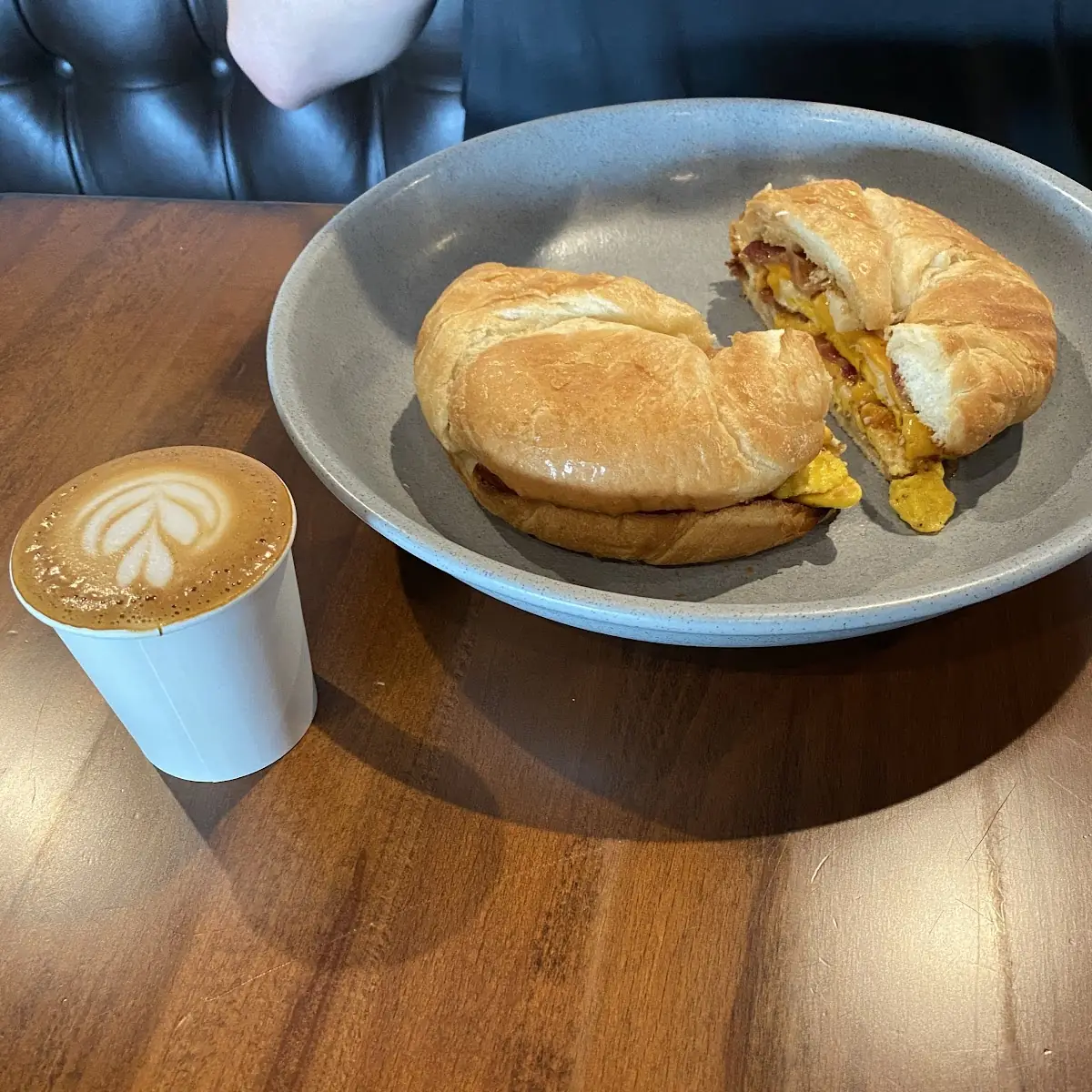 Bacon Egg and Cheese Croissant with a Cortado