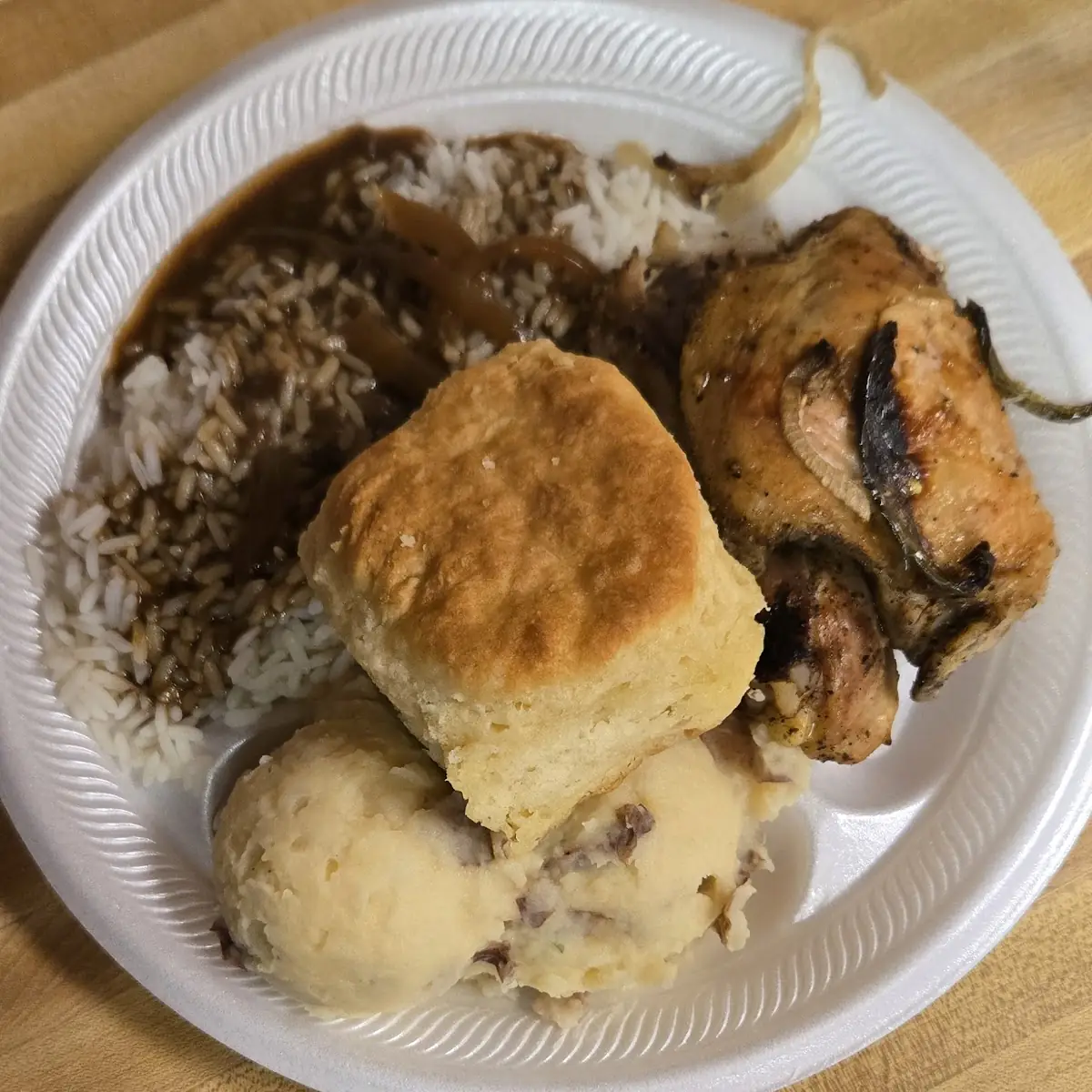 Thursday Only 2 PC Smothered Chicken Rice and Biscuit