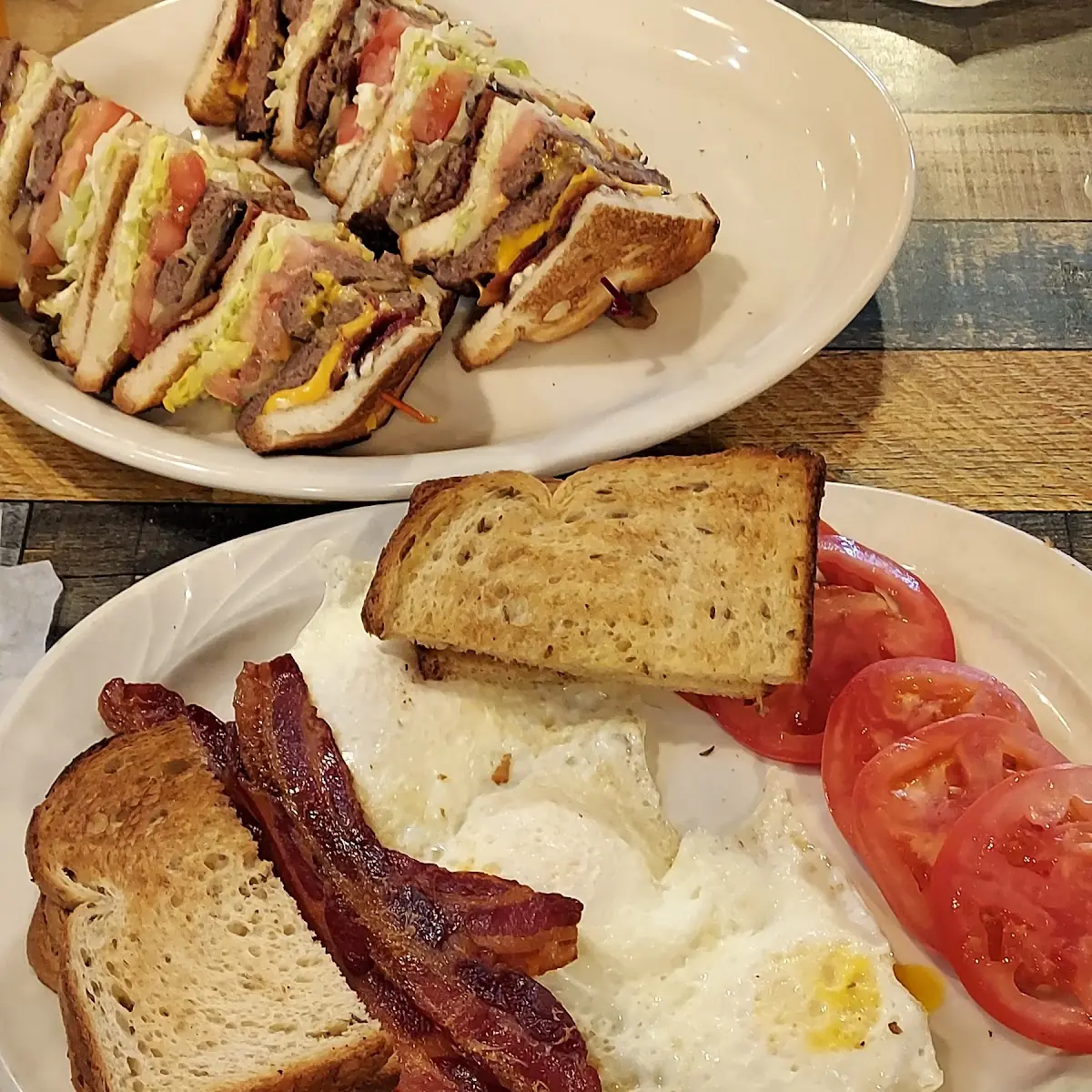 3 Eggs over Medium with Bacon Tomato Slices and Buttered Rye Toast