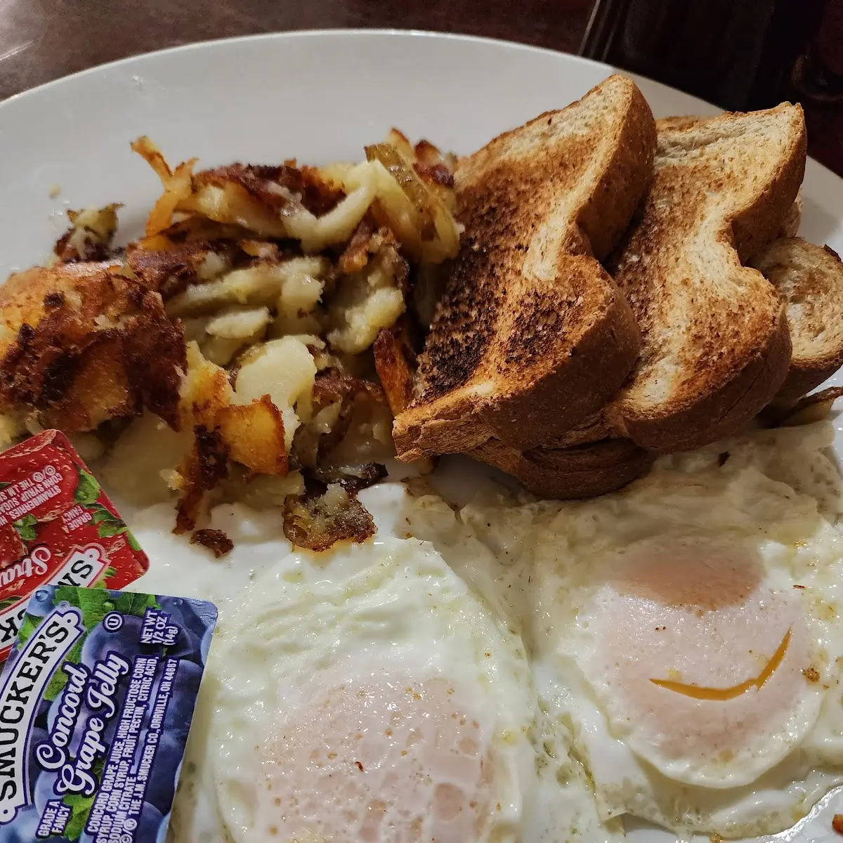 2 Eggs over Medium w Hash Browns and Toast