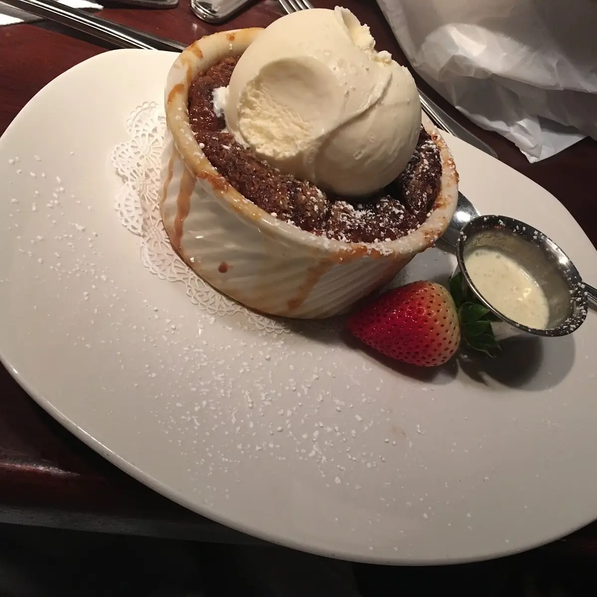 Praline Bread Pudding Soufflé with Vanilla Ice Cream & Bourbon Sauce