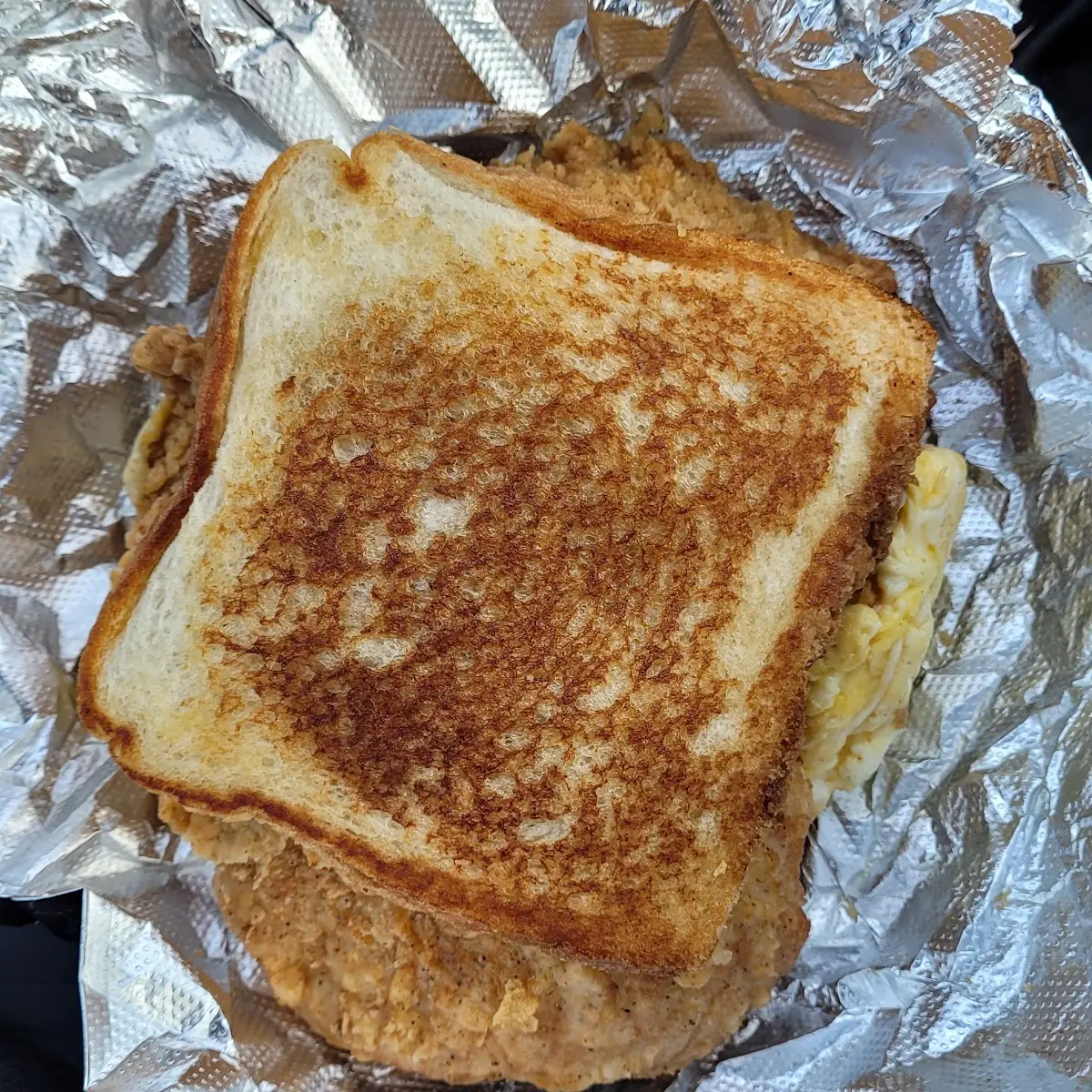 Fried Pork Chop Egg and Cheese Breakfast Sandwich