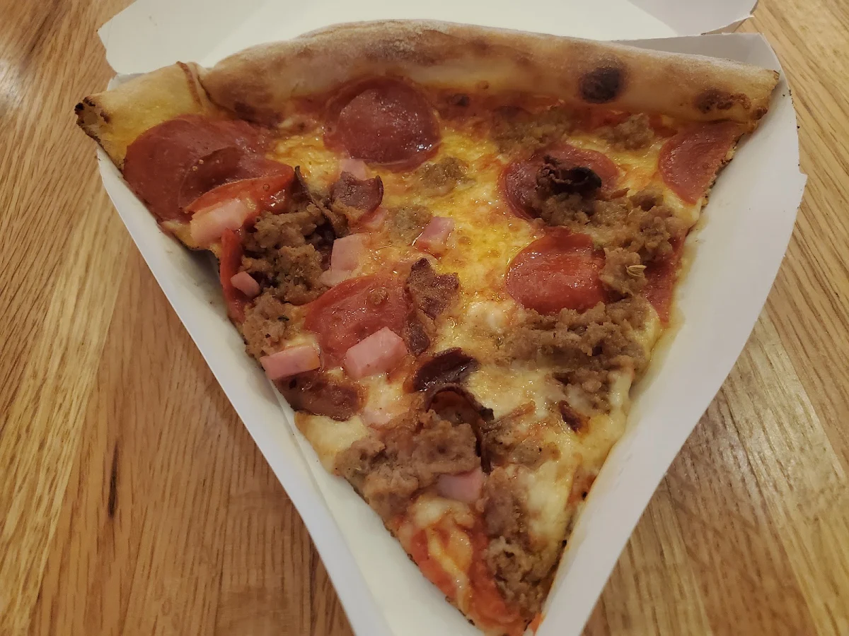 Pepperoni Sausage Ham and Bacon Pizza Slice