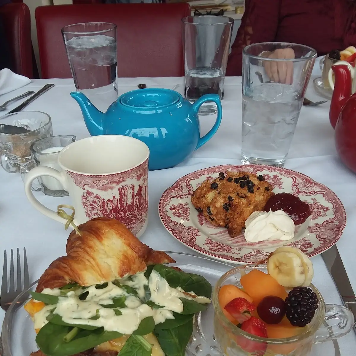 Breakfast Sandwich with a Fruit Cup and Currant Scone