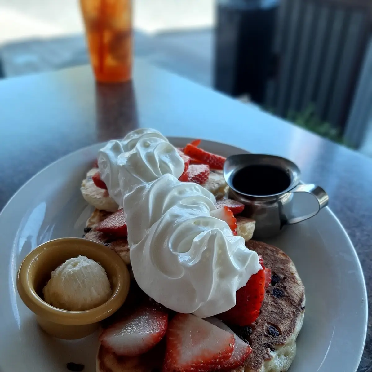 Chocolate Chip Pancakes with Strawberries and Whip Cream