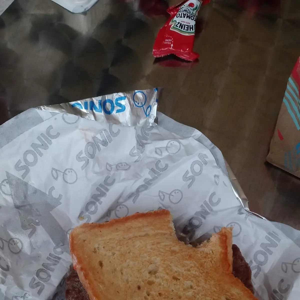 A Tiny Ass Burger with Evem Smaller Texas Toast