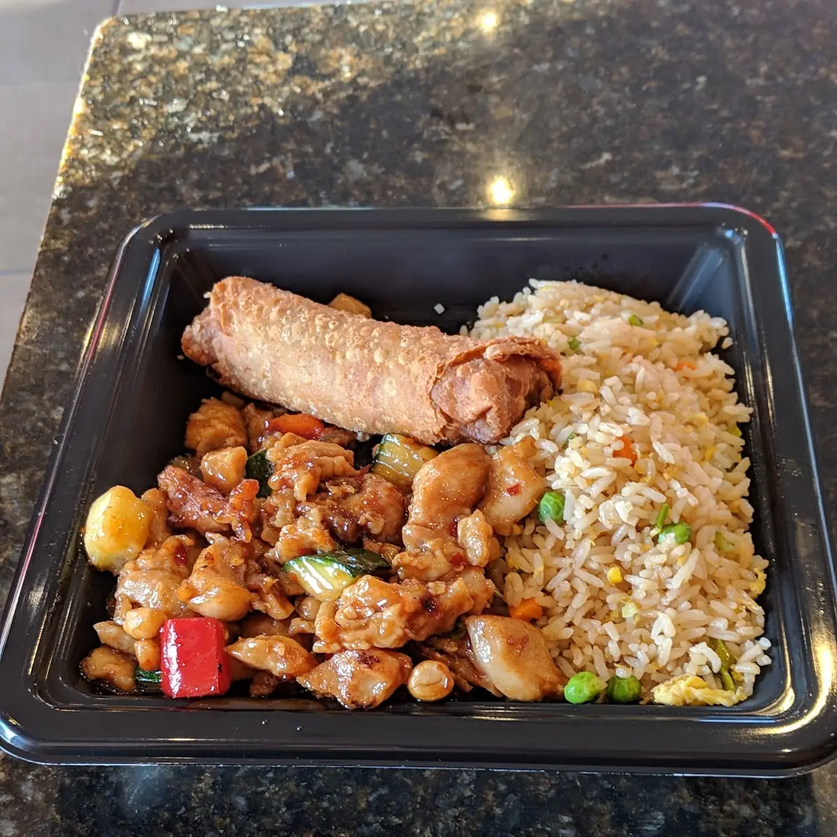 Kung Pao Chicken Vegetable Fried Rice and an Egg Roll