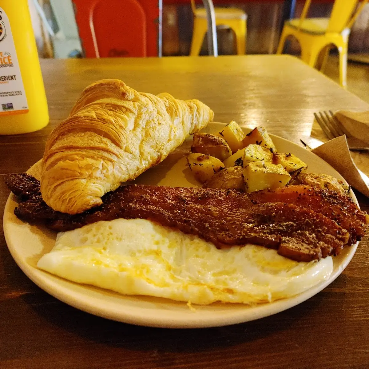 Eggs over Medium Brown Sugar Bacon Croissant with Potatoes