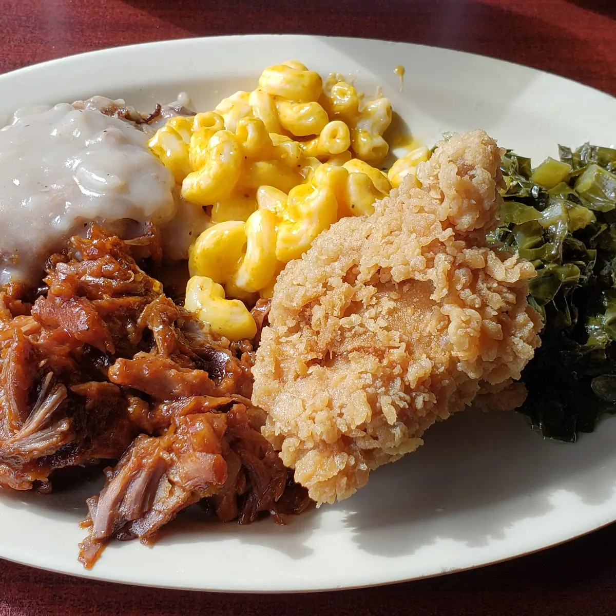 Mashed Potatoes with Gravy Fried Chicken Wings Rutabaga Cornbread Muffin and Mac and Cheese