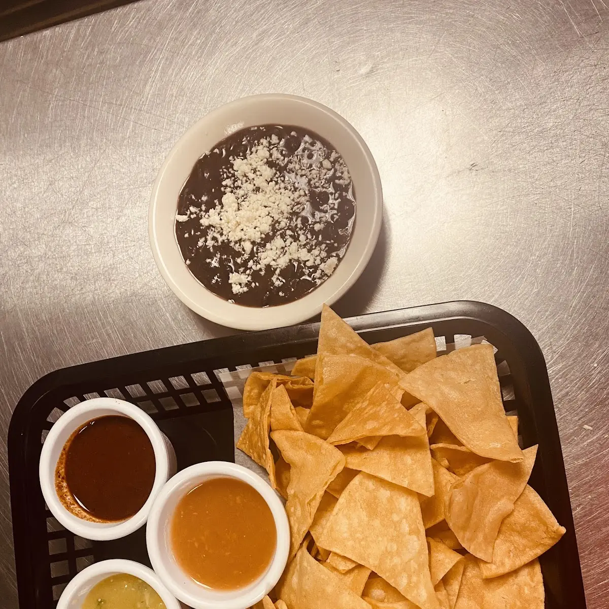 Nacho Chips with Beans Sauces and Sour Cream