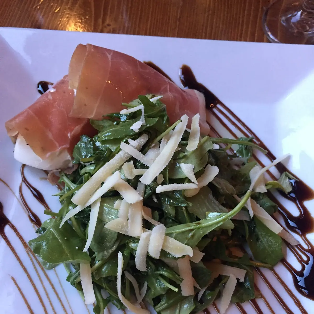 Fresh Mozzarella Wrapped in Prosciutto with Arugula