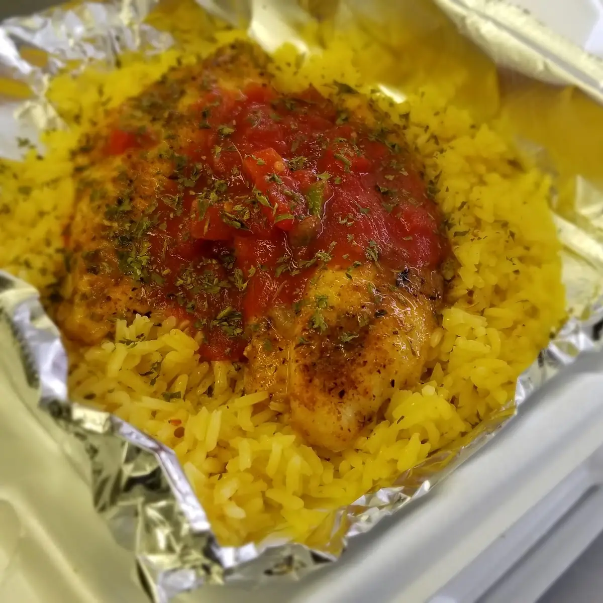 Blackened Catfish Served over Fried Rice