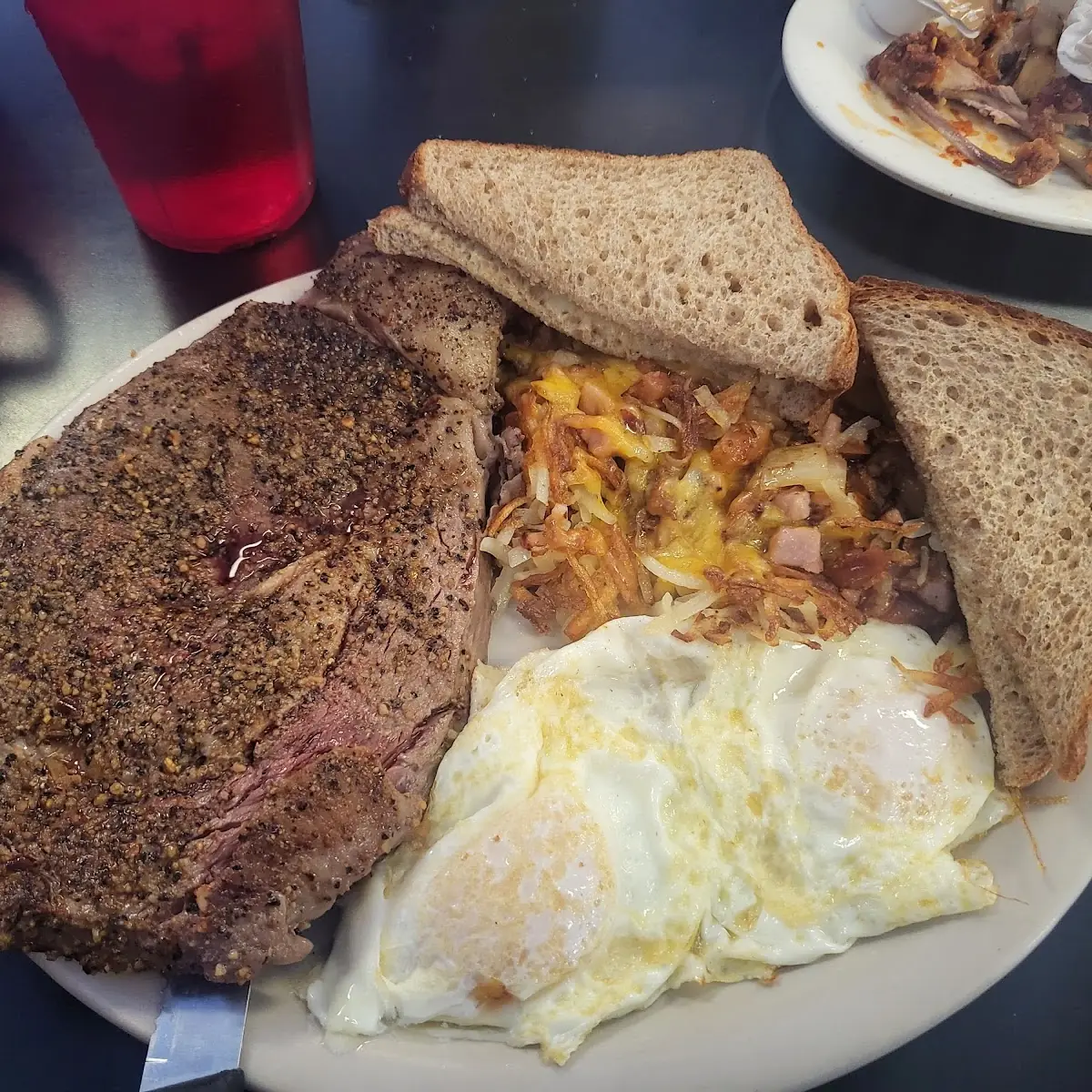 Ribeye Steak and Eggs with Loaded Hash Browns