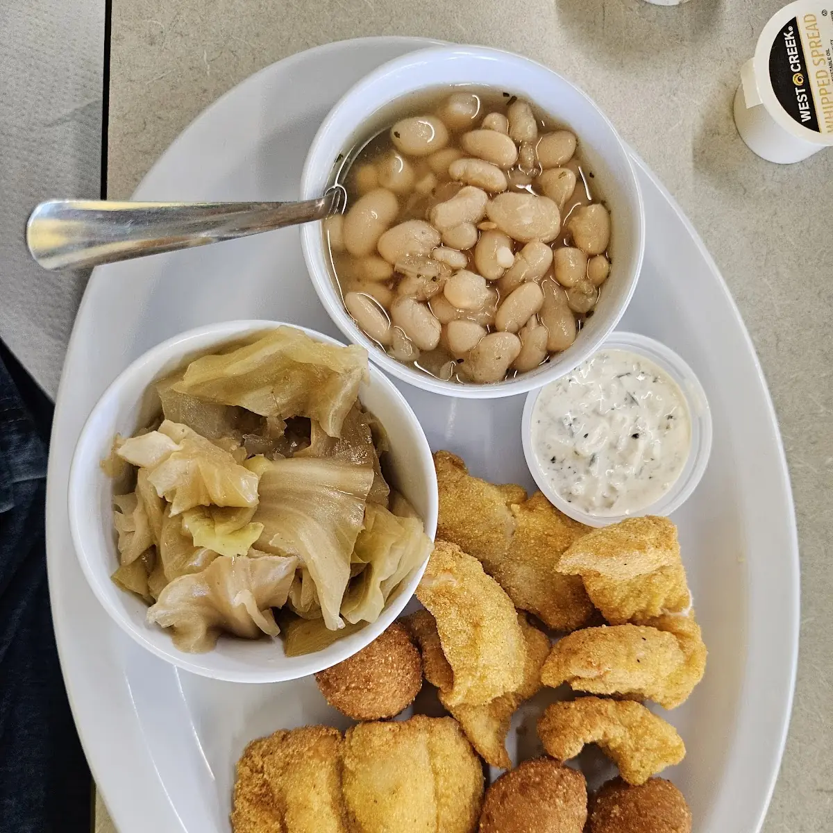 Fried Catfish Nuggets White Beans and Steamed Cabbage