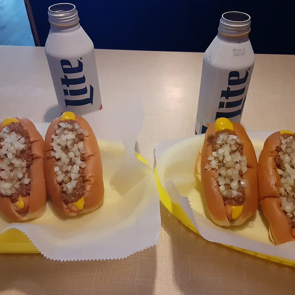 Hot Dogs with Chili Onions Mustard and Cold Miller Light