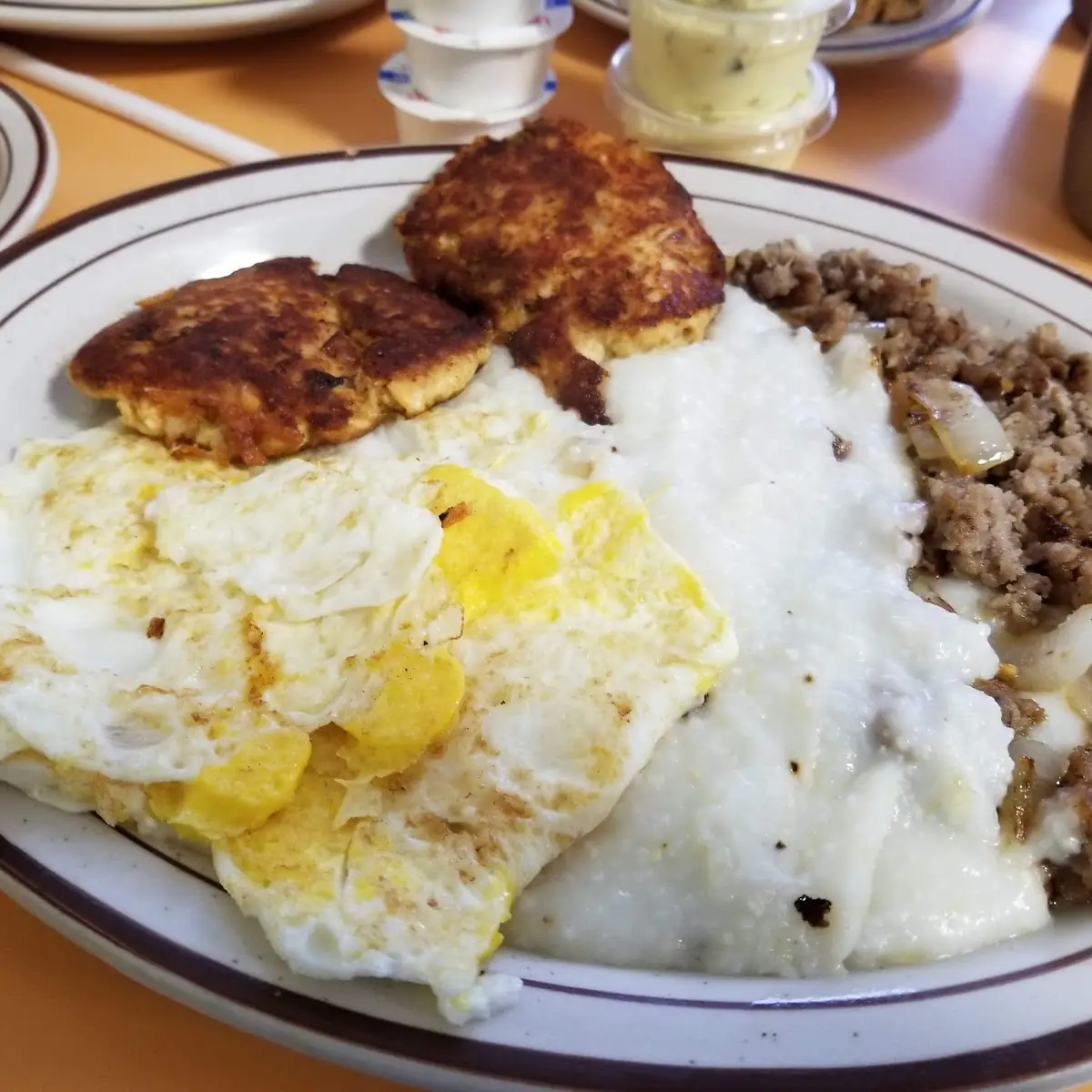 Crab Cakes and Fried Eggs with Grits