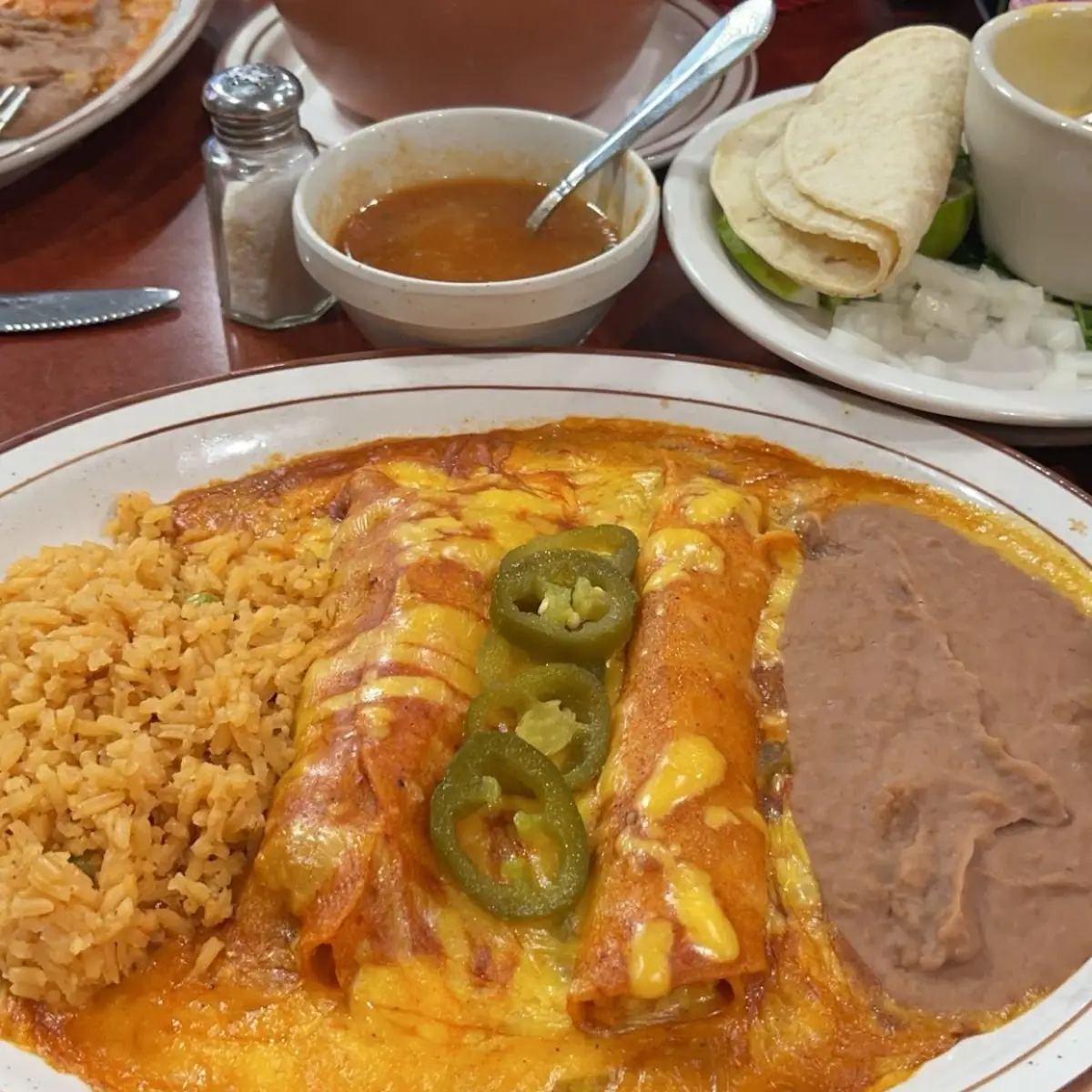 Two Cheese Enchiladas Guacamole Salad and a Cheese Puff