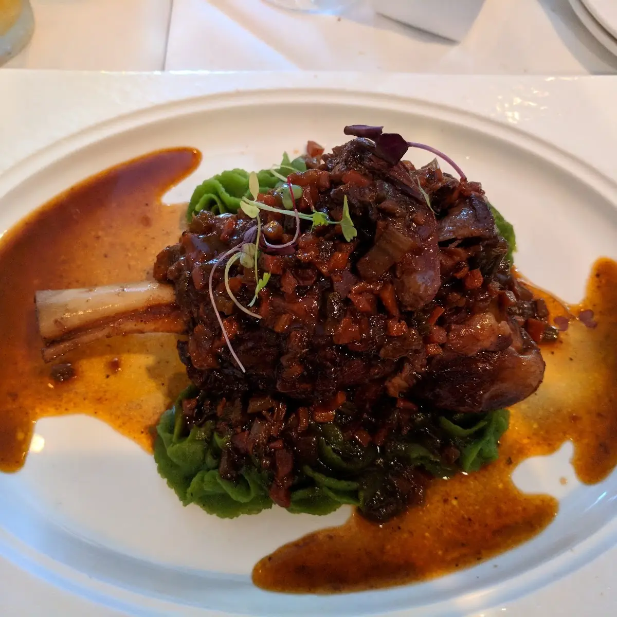 Lamb Shank Osso Bucco Style over Spinach Mashed Potatoes