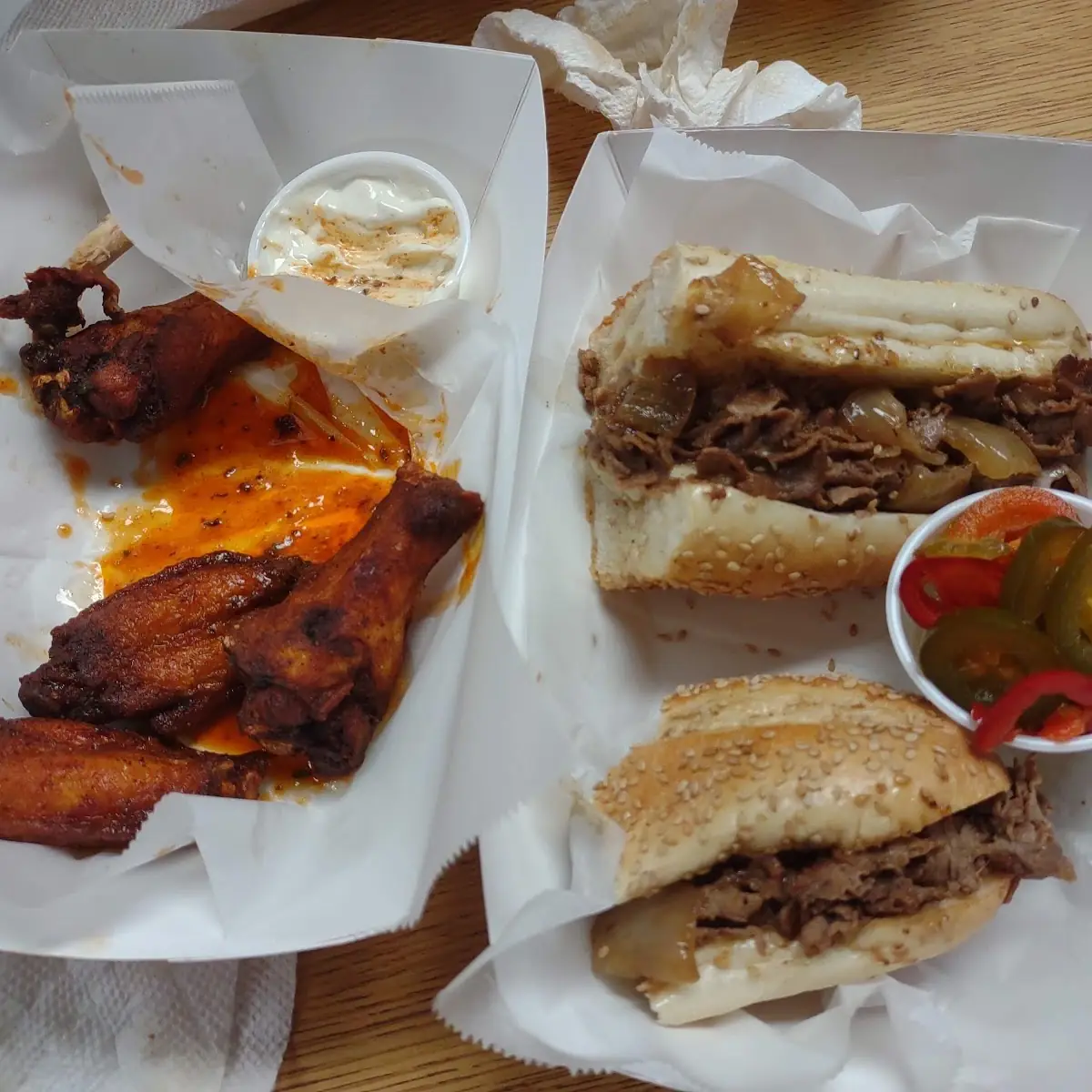 Cheese Steak with Onions and Buffalo Wings