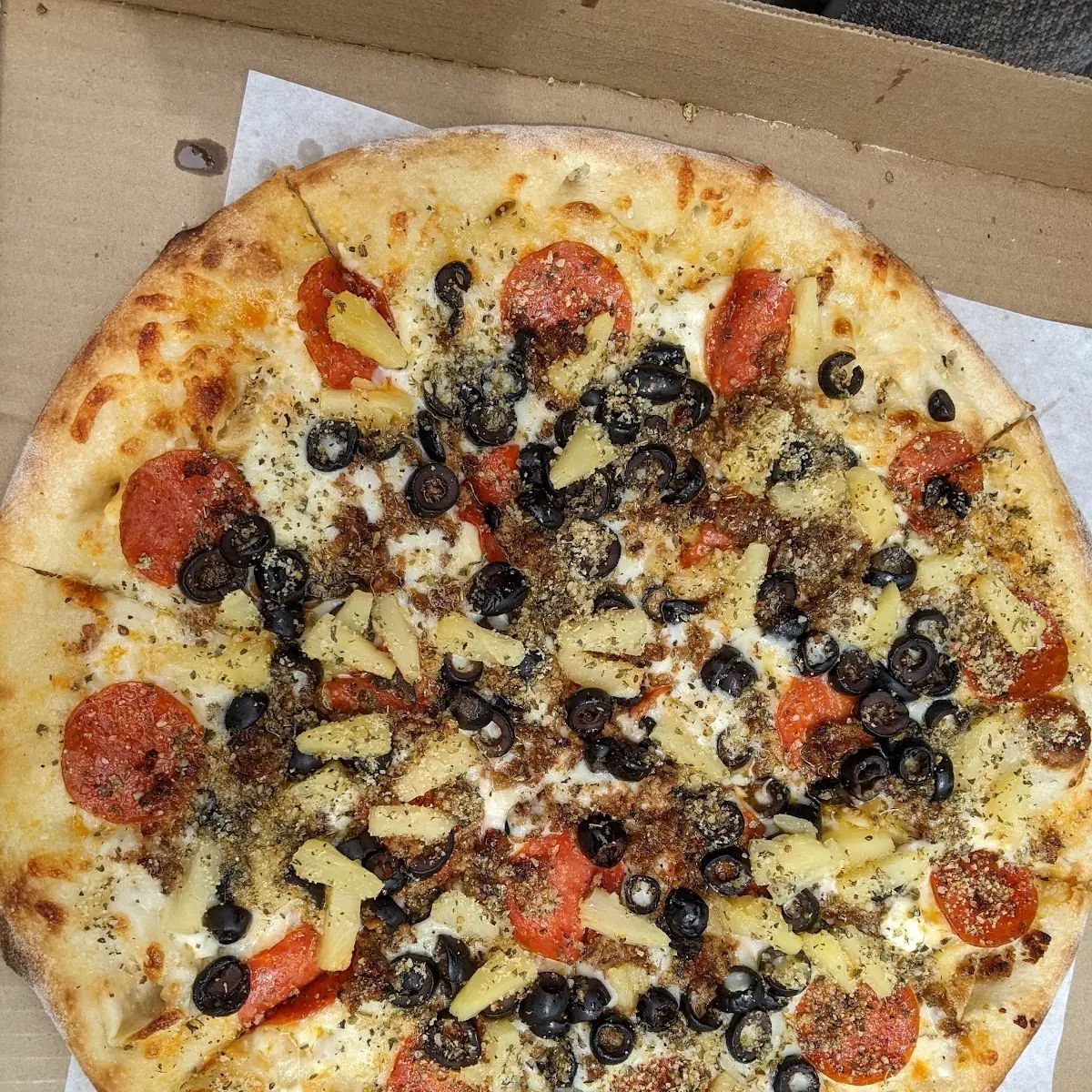 Triple-Blend Cheese Sauce Pepperoni Black Olives and Pineapple Pizza