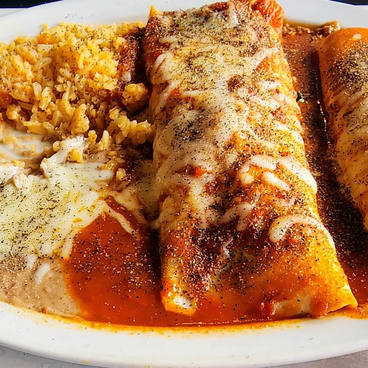You Pick 2 Beef Enchilada Beef Hard Shell Taco Beans and Rice