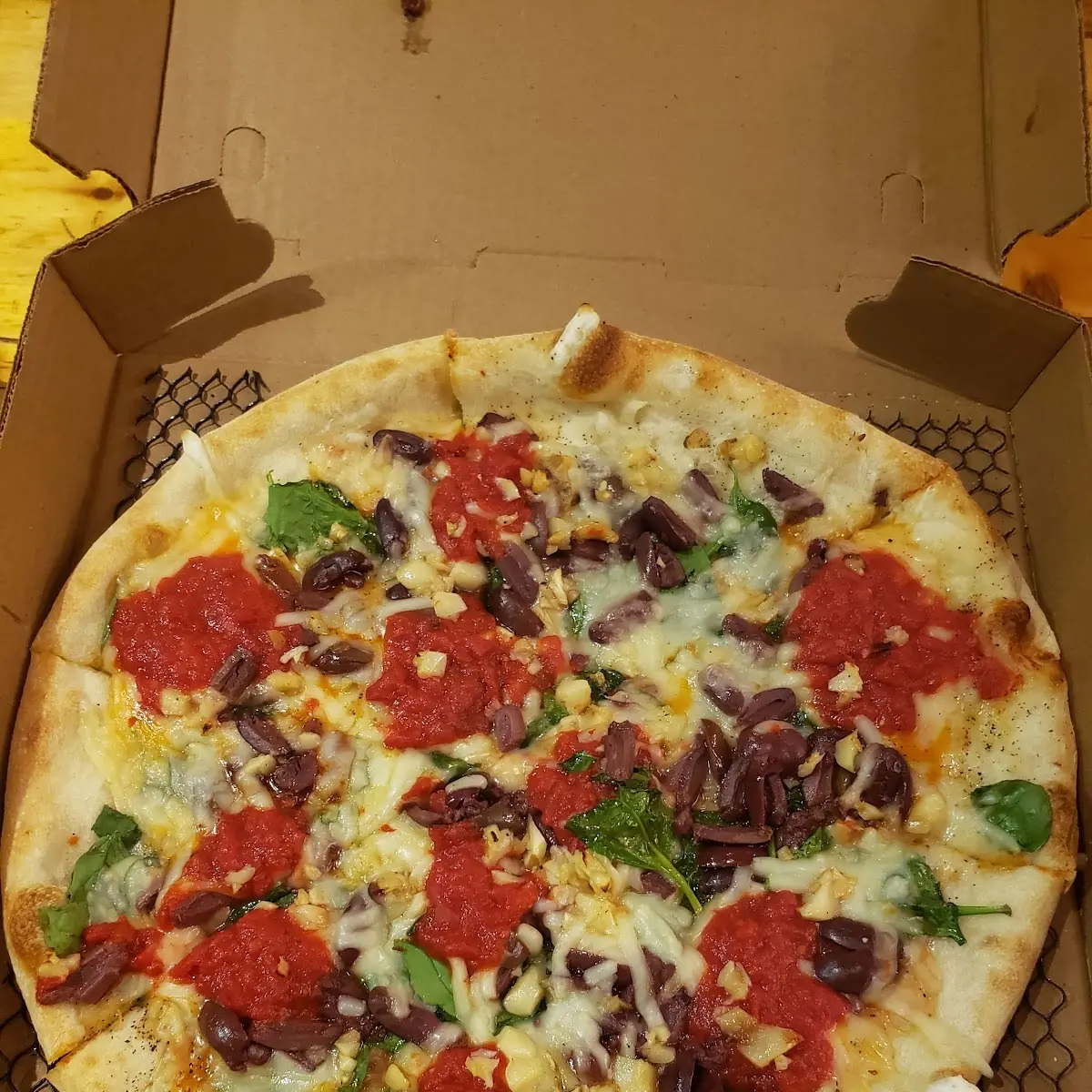 Spinach Kalamata and Roasted Garlic Vegan Pizza