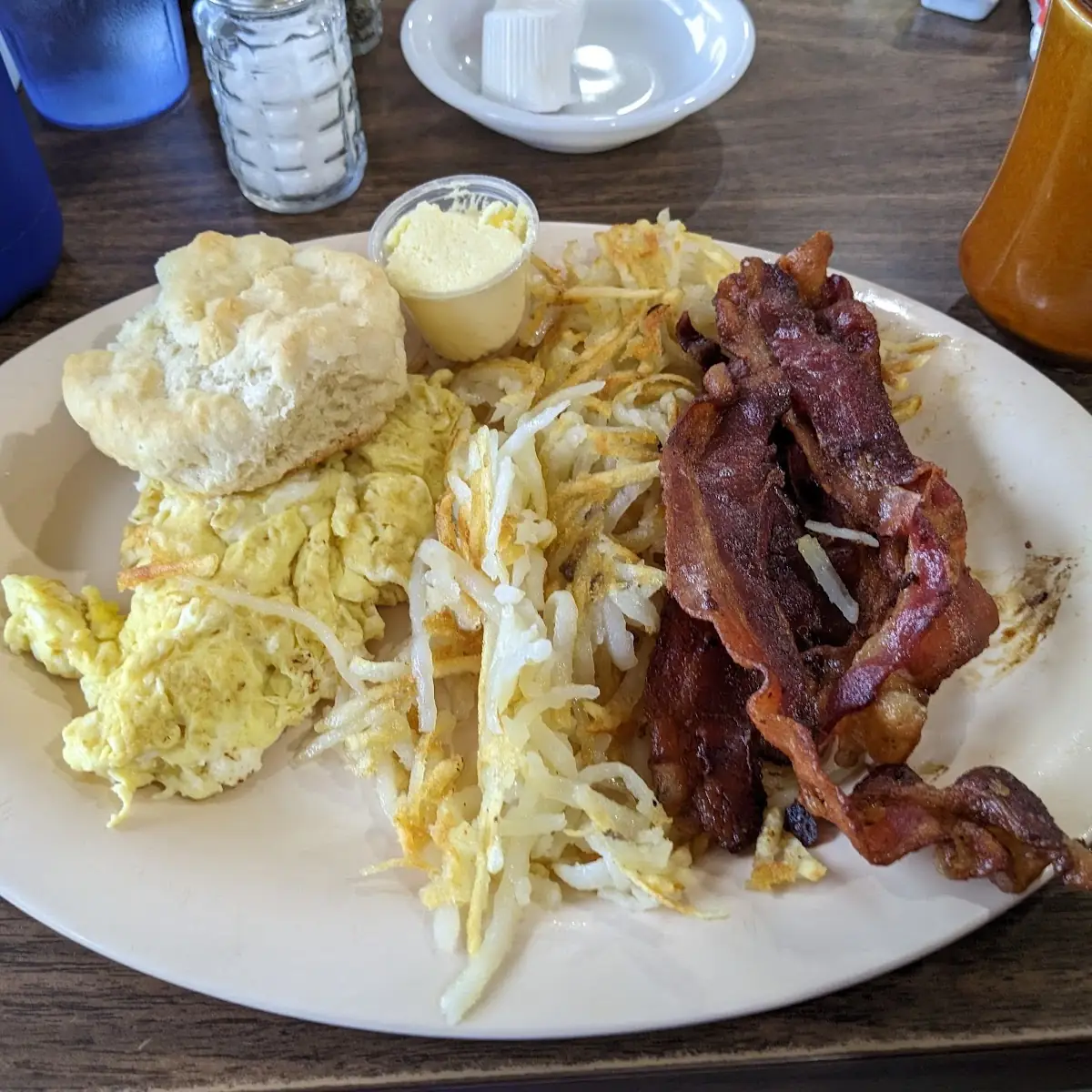 Two Eggs Any Style Hash Browns Bacon and a Biscuit