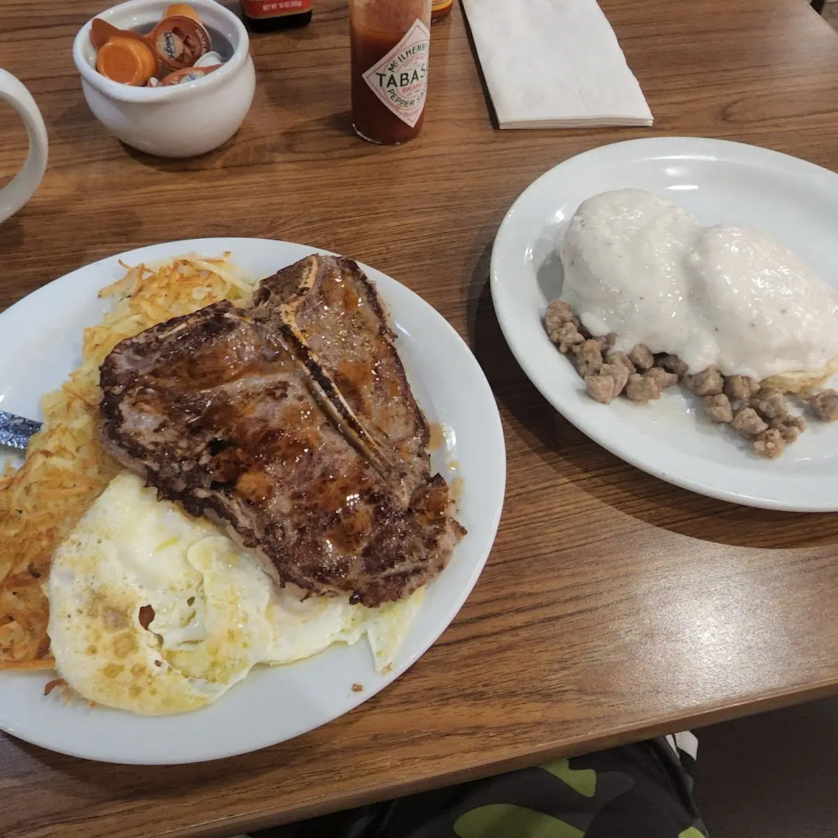 T Bone Steak Eggs Hash Browns Biscuit and Gravy