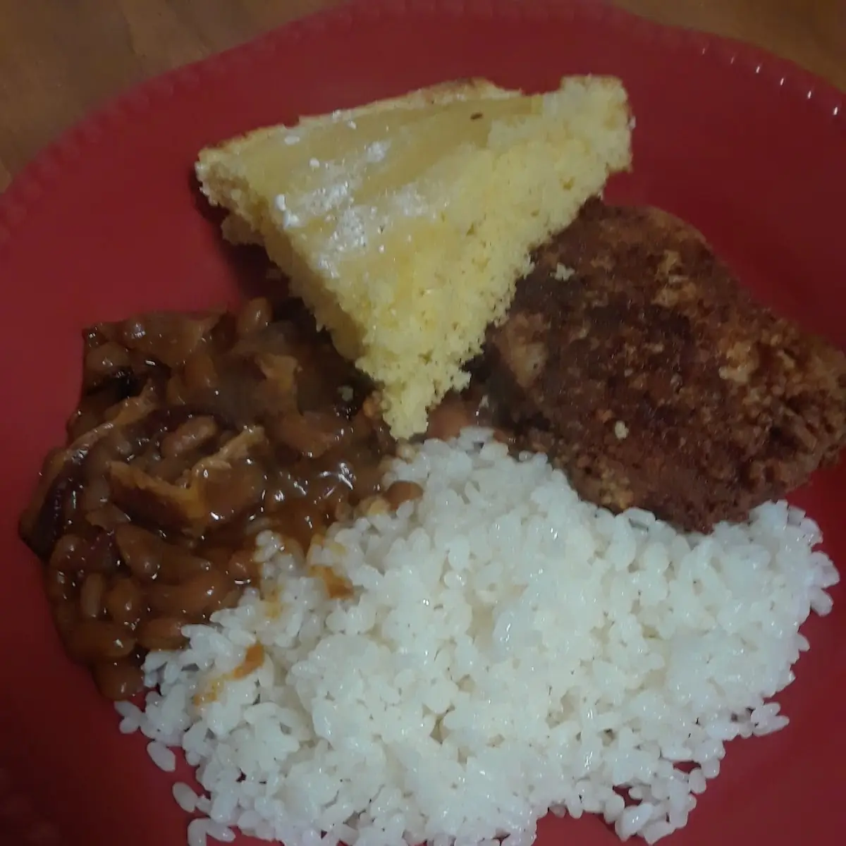 White Rice Baked Beans Corn Bread and Breaded Porkchops
