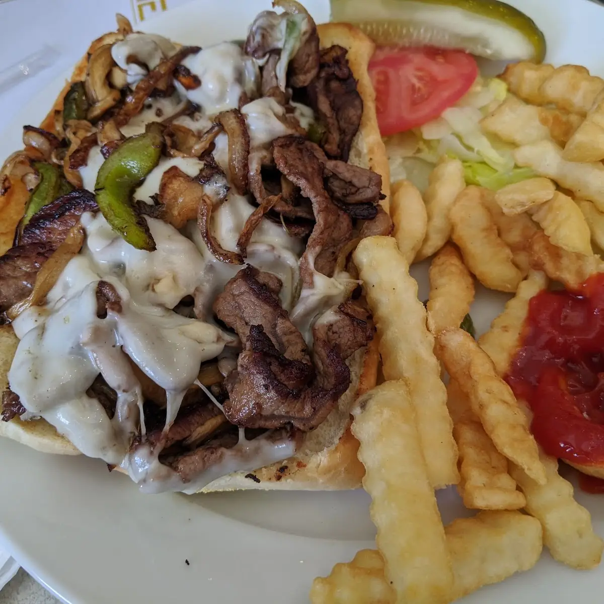 Philly Cheese Steak Sandwich and Fries