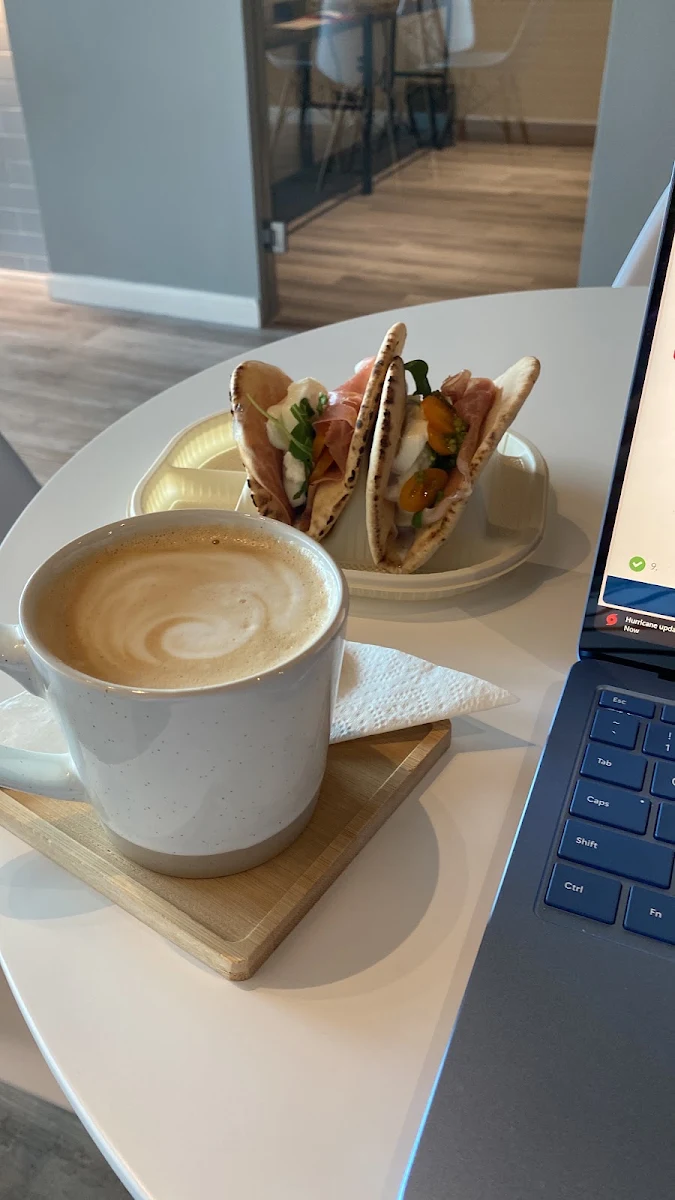 Cafe and a Mozz and Prosciutto Sandwich