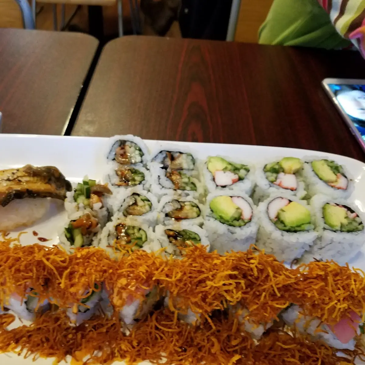 Specialty Roll with Shrimp Tempura Inside and Fried Yam on Top