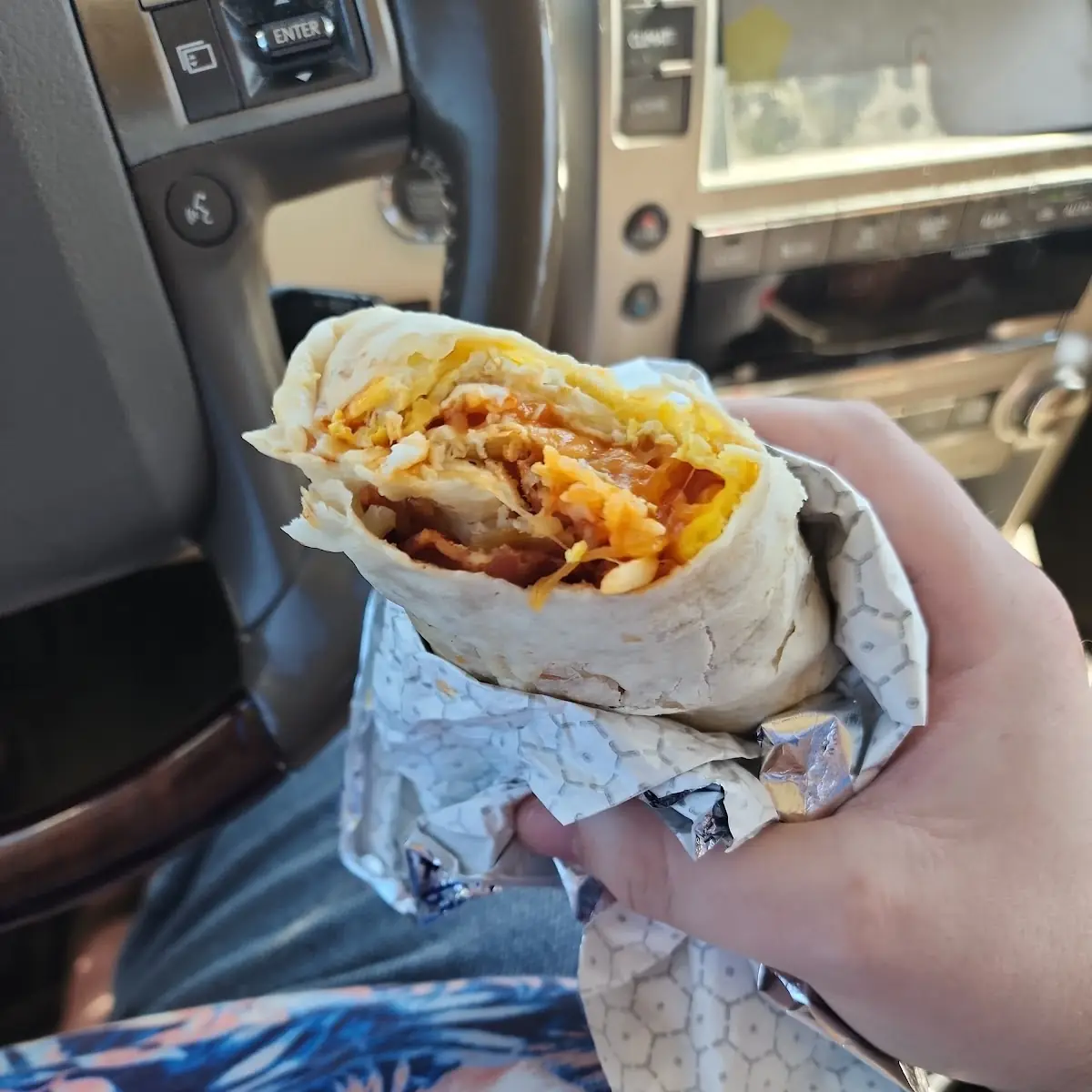 Bacon Egg and Cheese Breakfast Burrito with Red Sauce