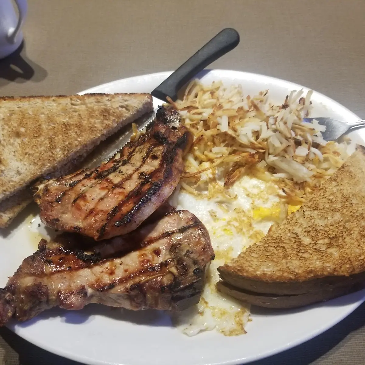 Pork Chops with Eggs Style Iowa 80 Kitchen