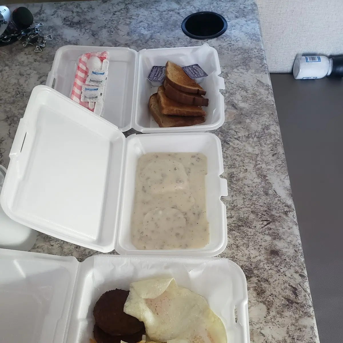 Eggs Bacon Toast Hash Browns Biscuits and Gravy
