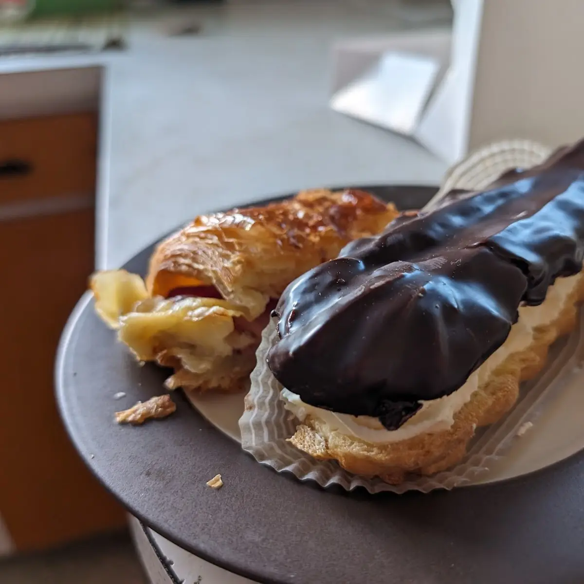 Chocolate Eclair and Half a Ham and Cheese Croissant