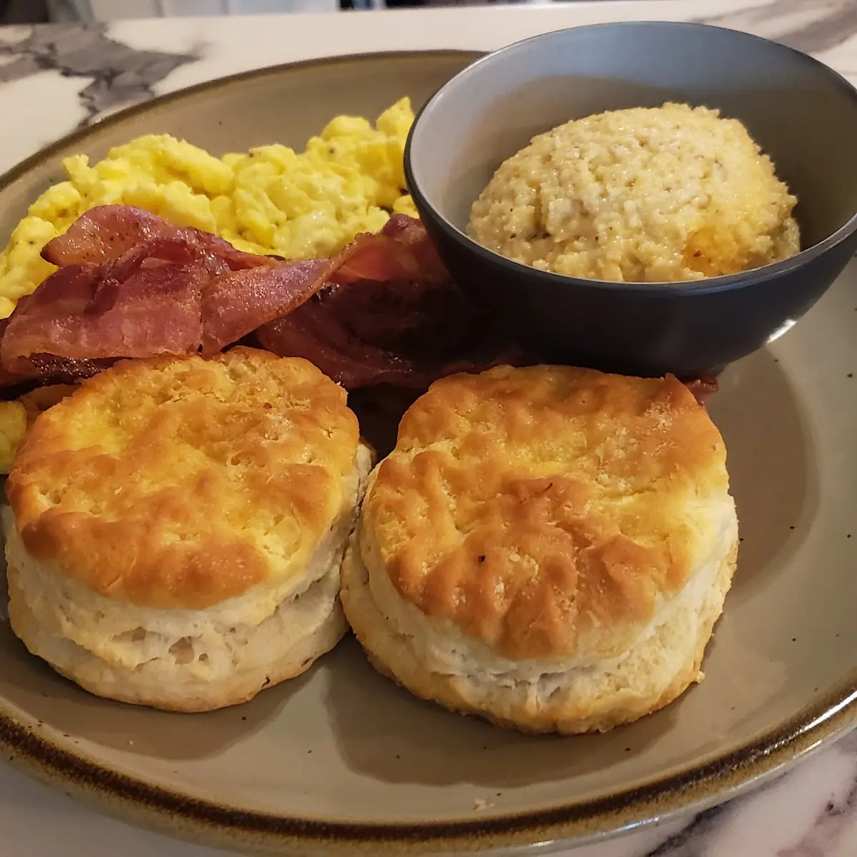 Eggs Bacon Cheesy Grits and Biscuits
