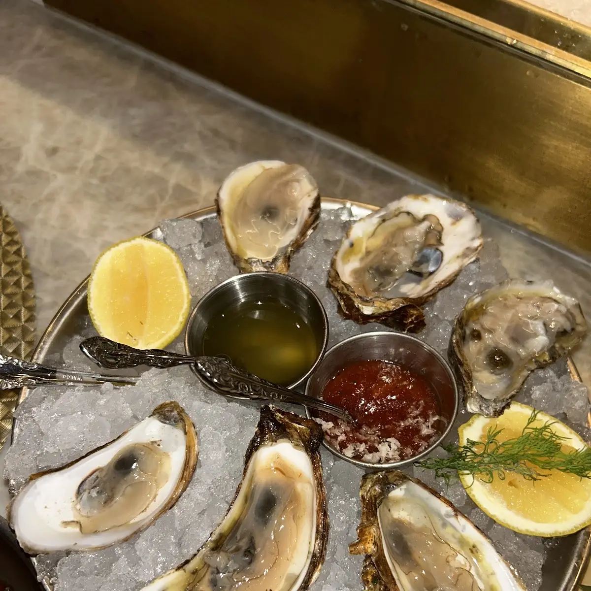 Raw Oysters on Ice with Sauces and Lemon