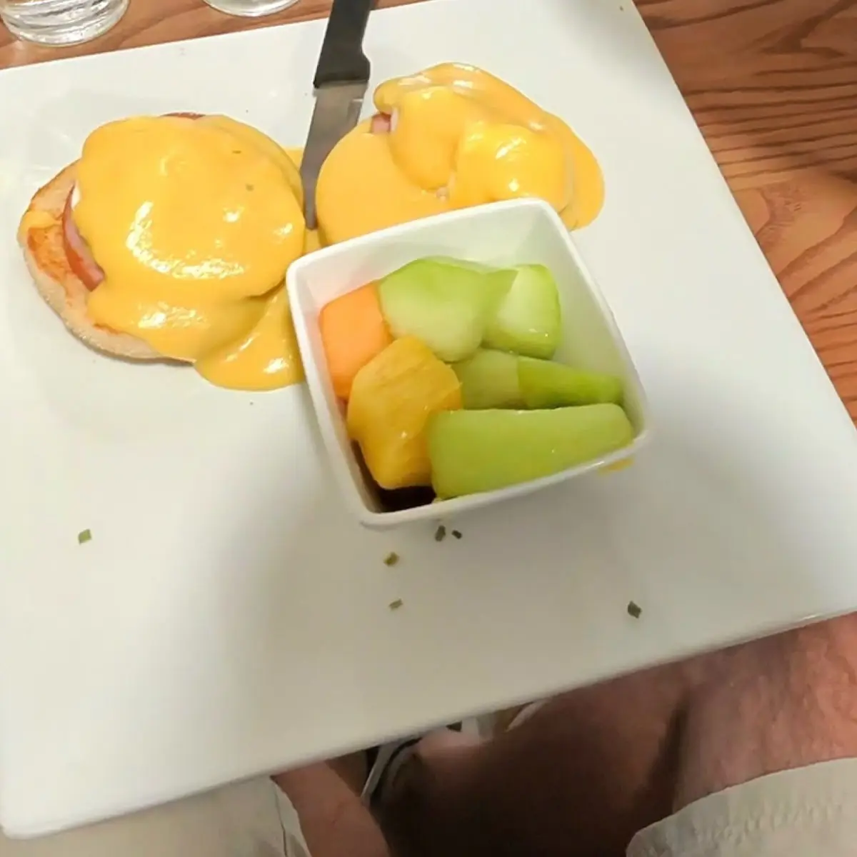 Eggs Benedict with a Side of Fruit