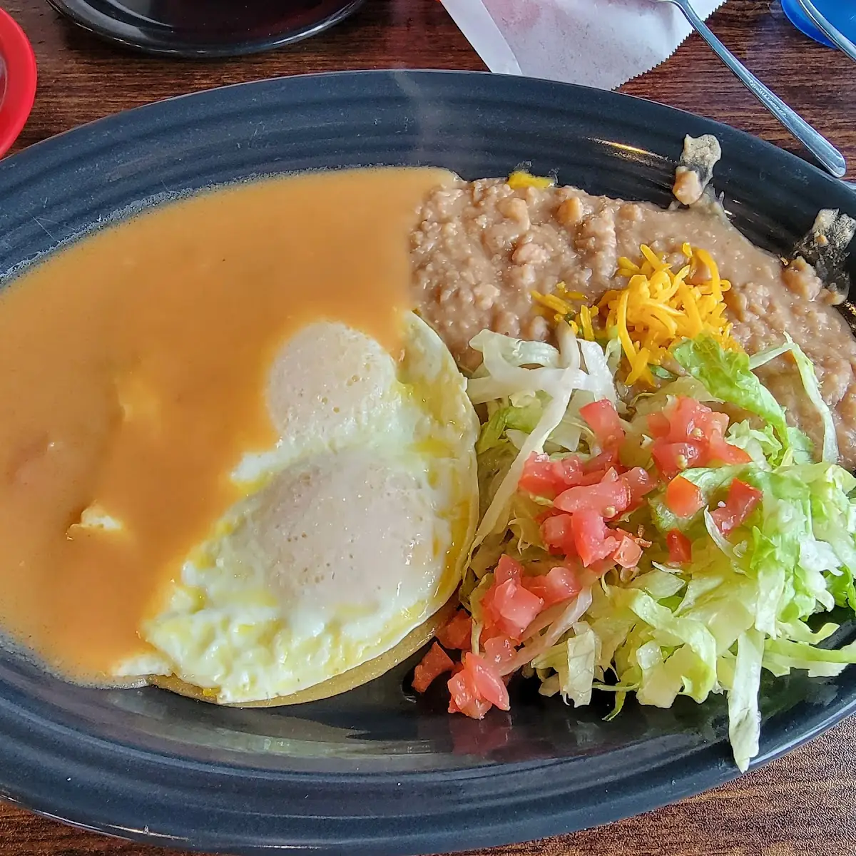 Huevos Rancheros Eggs over Medium Lettuce and Tomatoes in Place of Rice