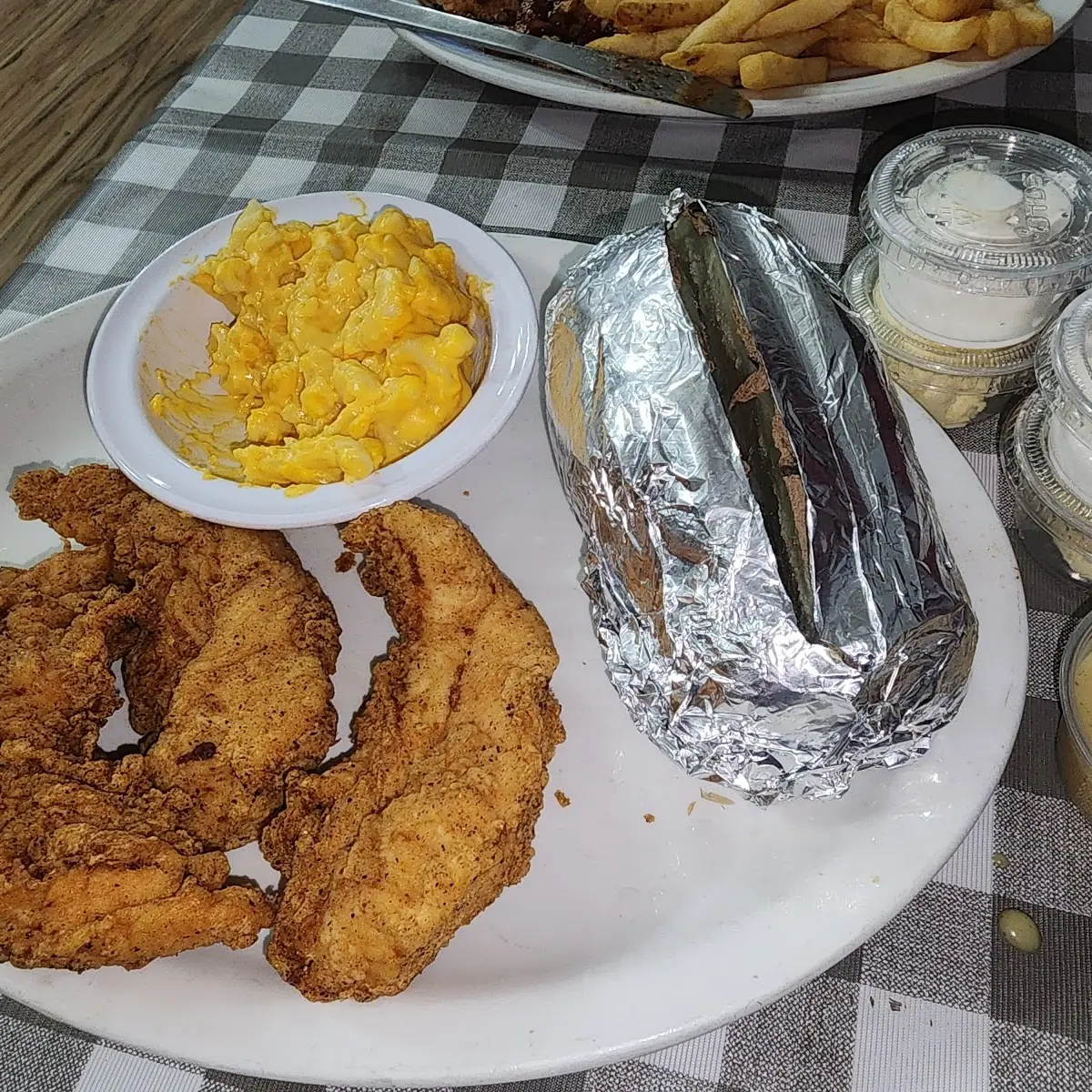 Hand Battered Chicken Strips Baked Potato and Mac and Cheese