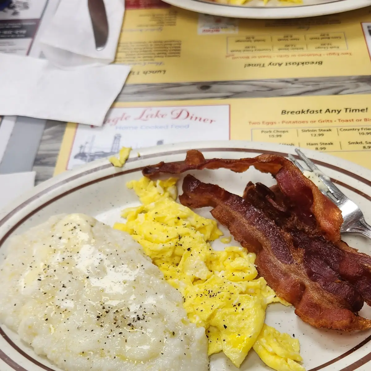 Two Eggs Potatoes Grits Toast or Biscuit